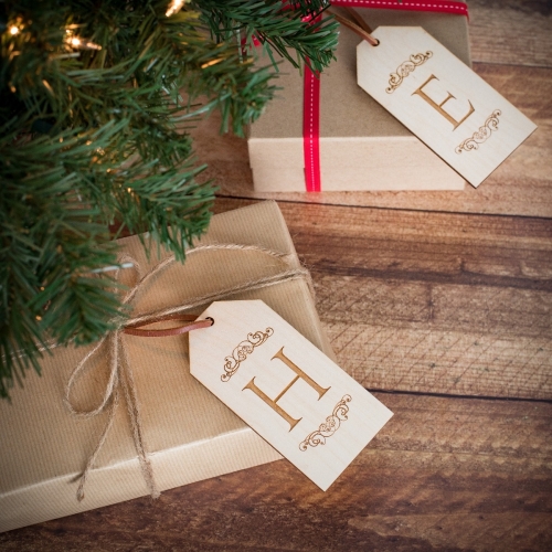 Two Personalised Christmas Gift Tags With The Initial Design